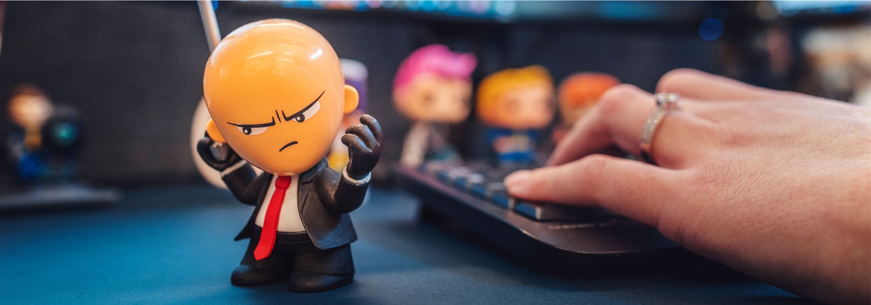 A small plastic version of the game character Hitman standing on a table