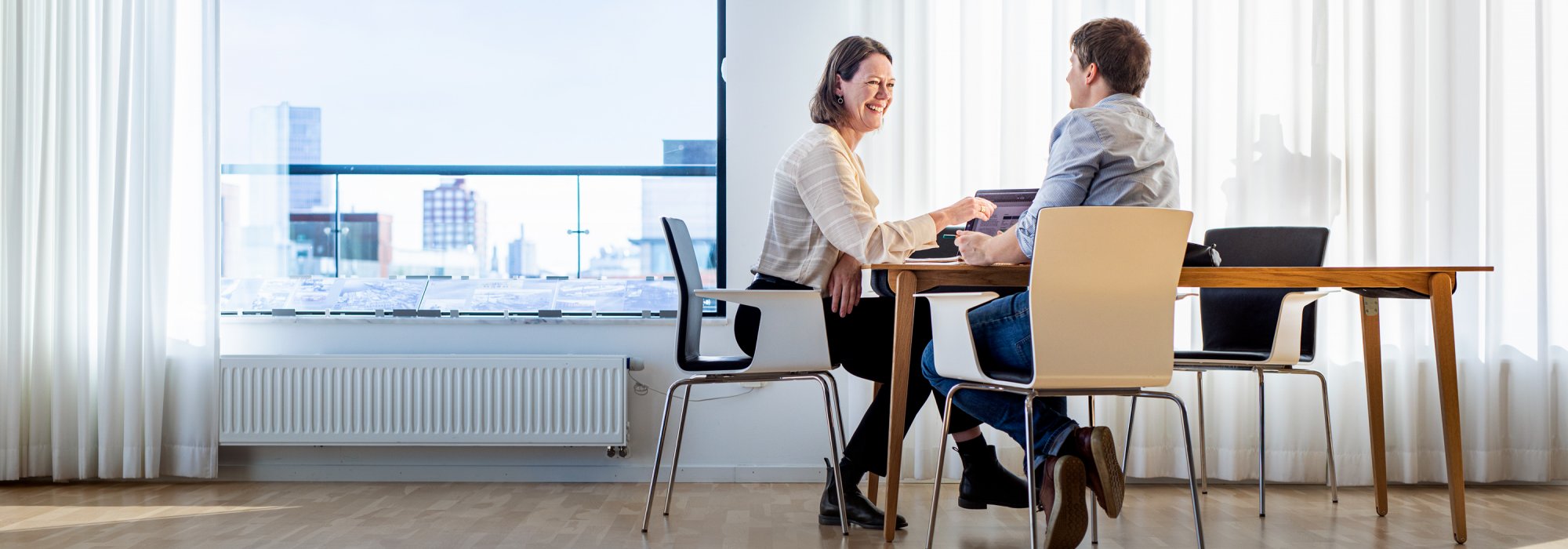 Two persons having a business meeting