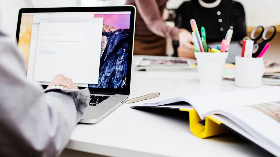 3 persons, one computer and a folder