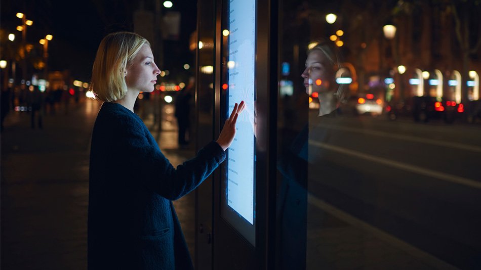 Woman interacting with screen