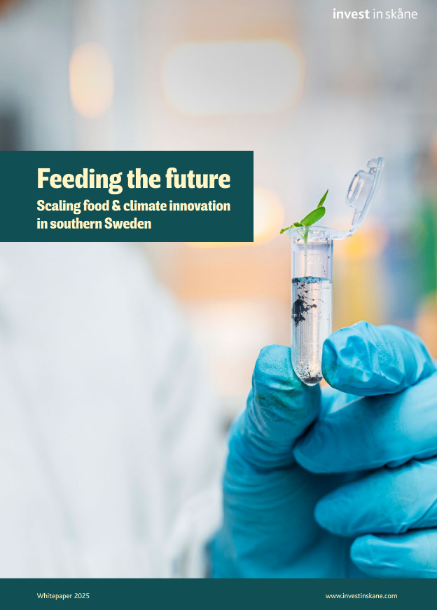 Front page of a report showing gloved hand holding a small testube