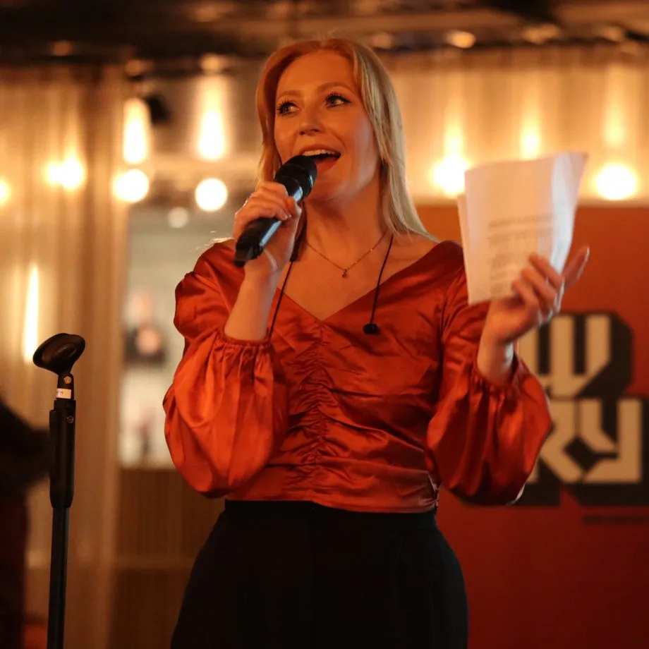 Woman talking in a microphone